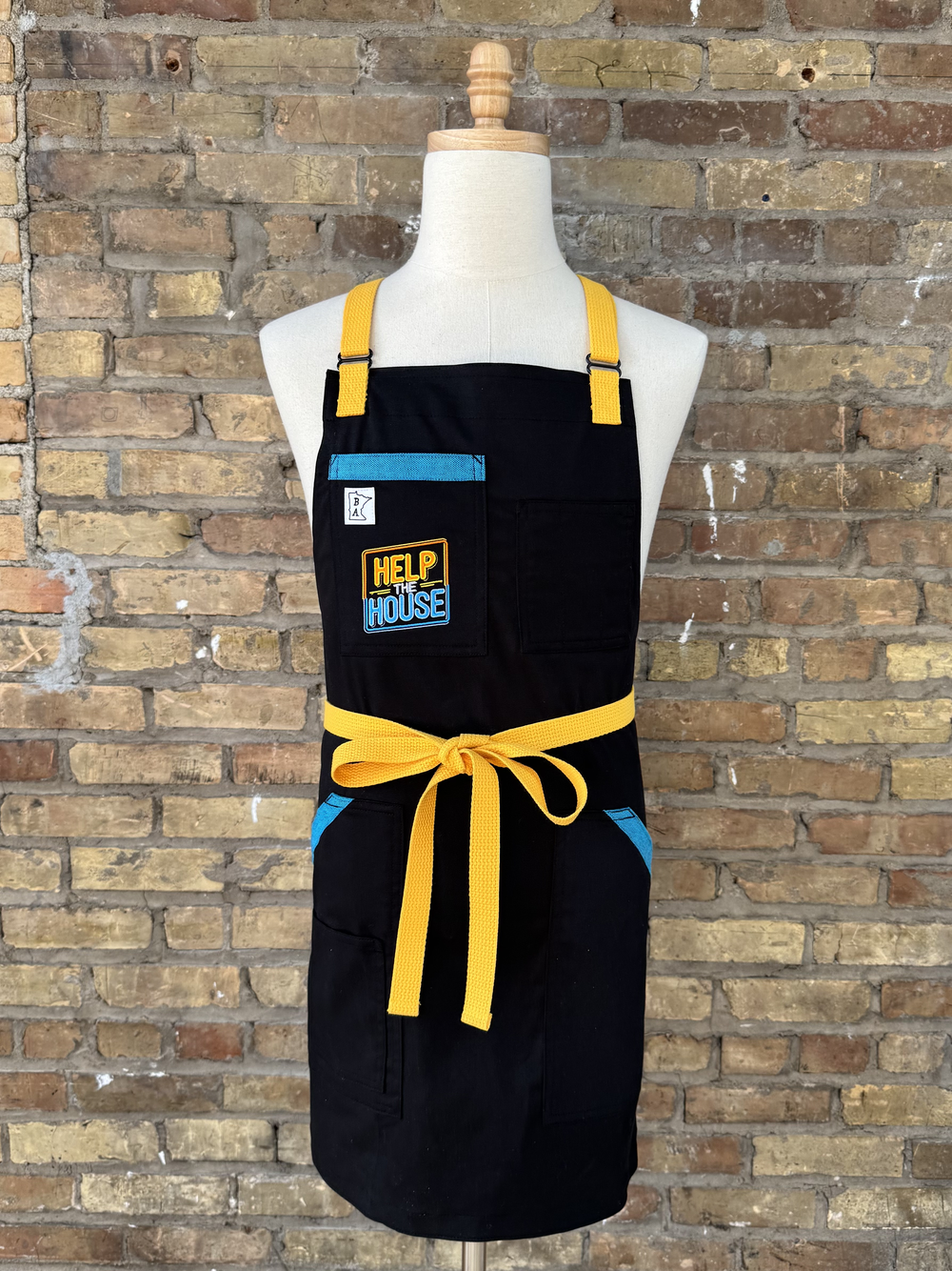 Help the House Foundation's branded Hats, T-shirts, Sweatshirts, and Craftmade Aprons designed Aprons